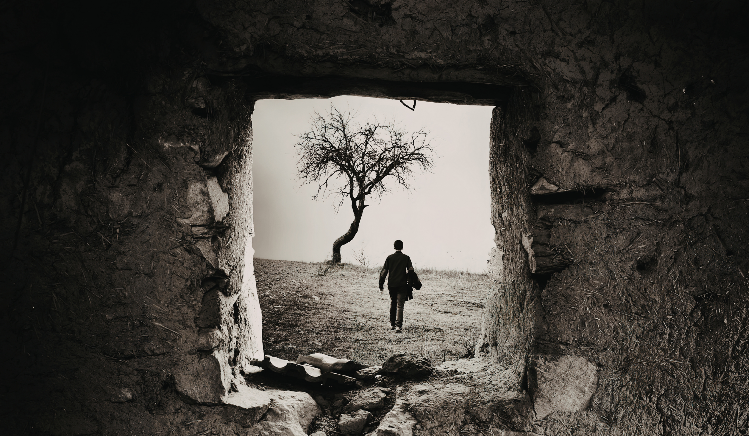 Man breaks through tunnel of cracked soil at dusk, symbolizing dark night of the soul transformation and spiritual rebirth.