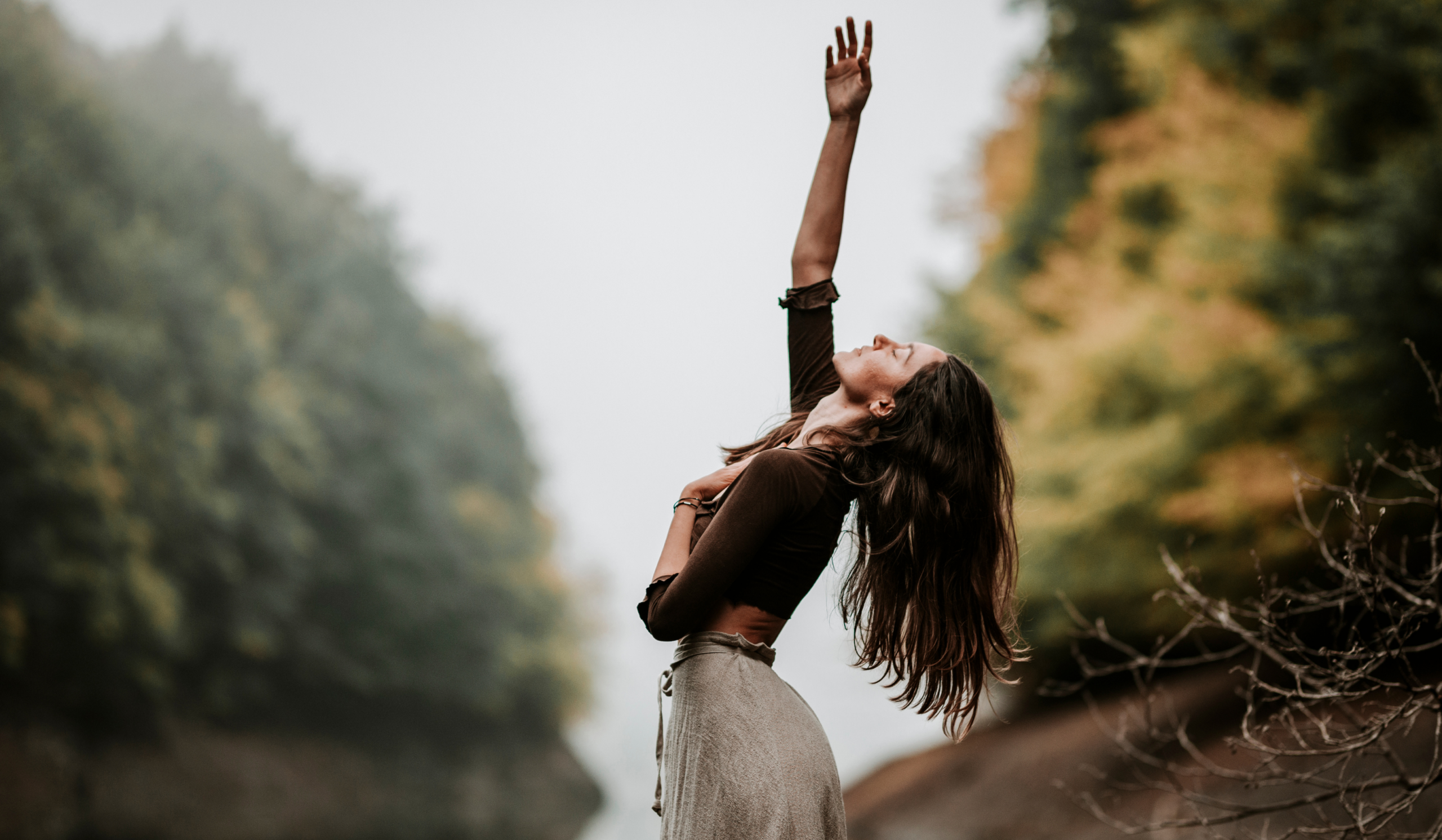 Highly sensitive person moving from a guarded posture into an open, embodied stance, symbolizing safety giving way to power.